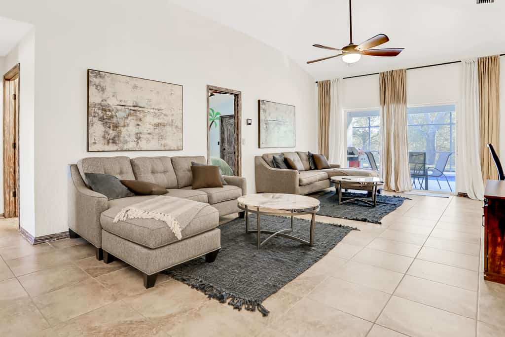 Peaceful home with an enclosed patio, pool, grill, washer/dryer, & AC