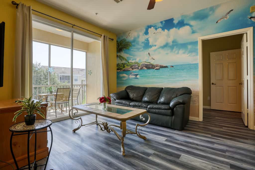 Resort condo with pools, hot tub, game room, tennis, gym, balcony, AC, & W/D
