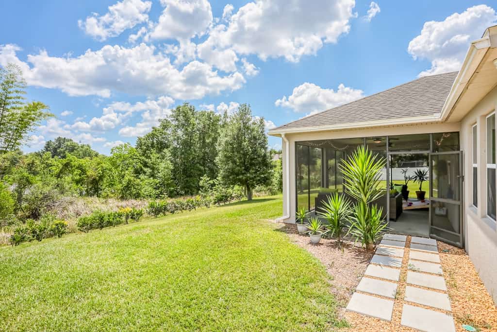 Dog-friendly ground-floor home in gated community w/lake views & enclosed patio