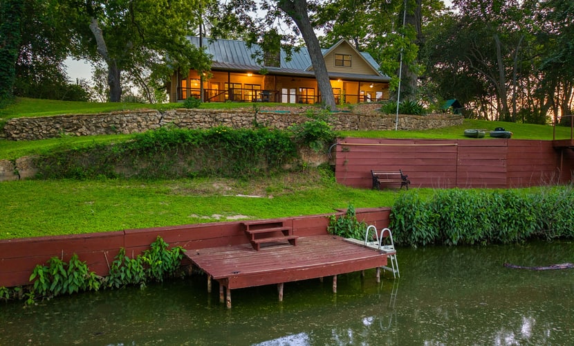 Riverfront home on Lake Seguin with dock, kayaks, beautiful views & air hockey