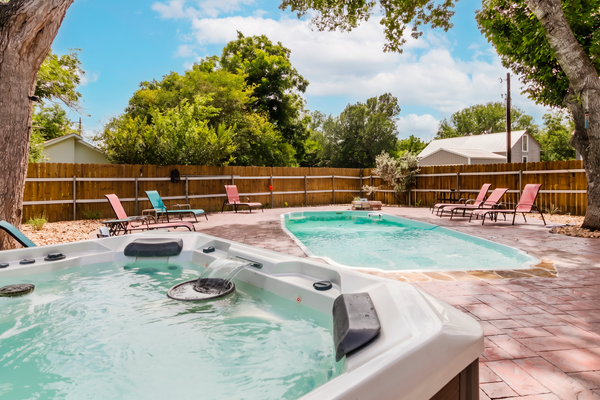 Idyllic waterfront getaway with private hot tub & deck views - near golf