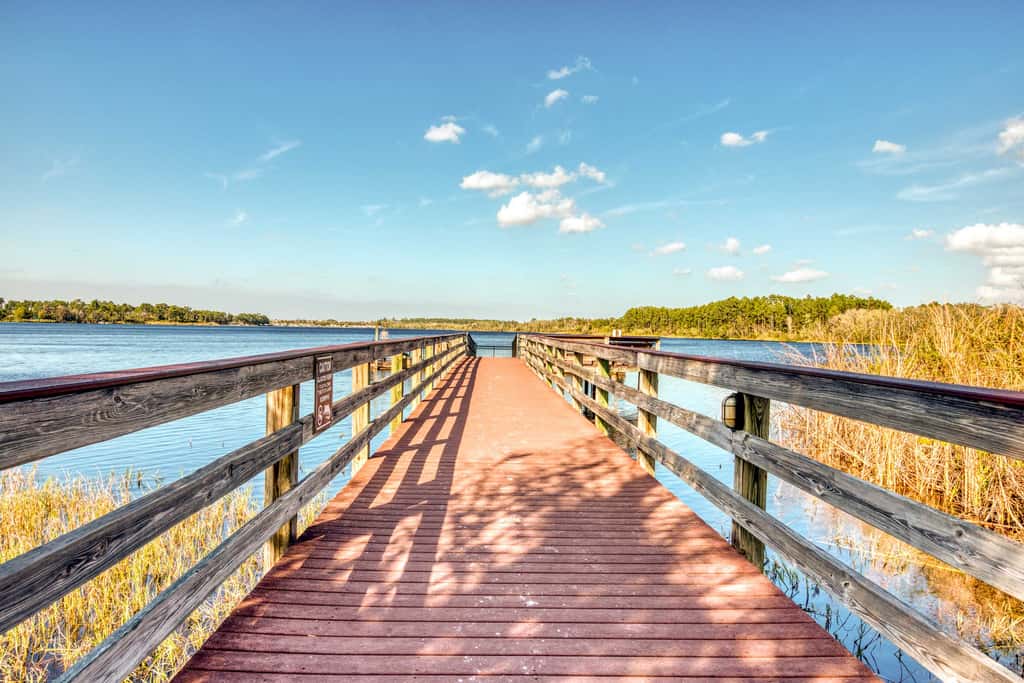 First floor lake view condo w/ pool & hot tub access, private W/D, & central AC