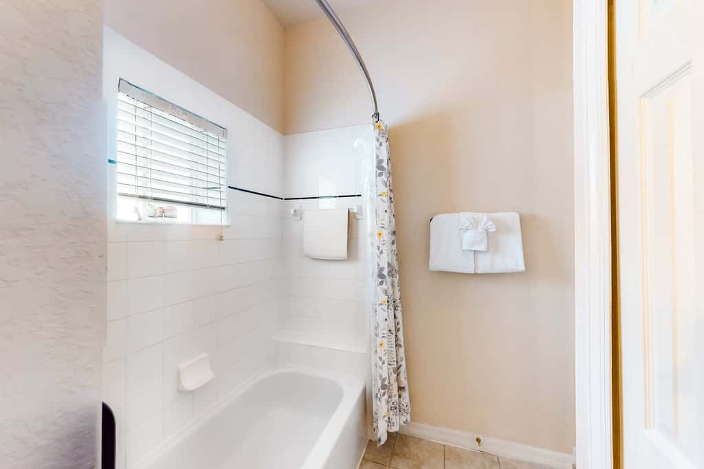 First floor lake view condo w/ pool & hot tub access, private W/D, & central AC