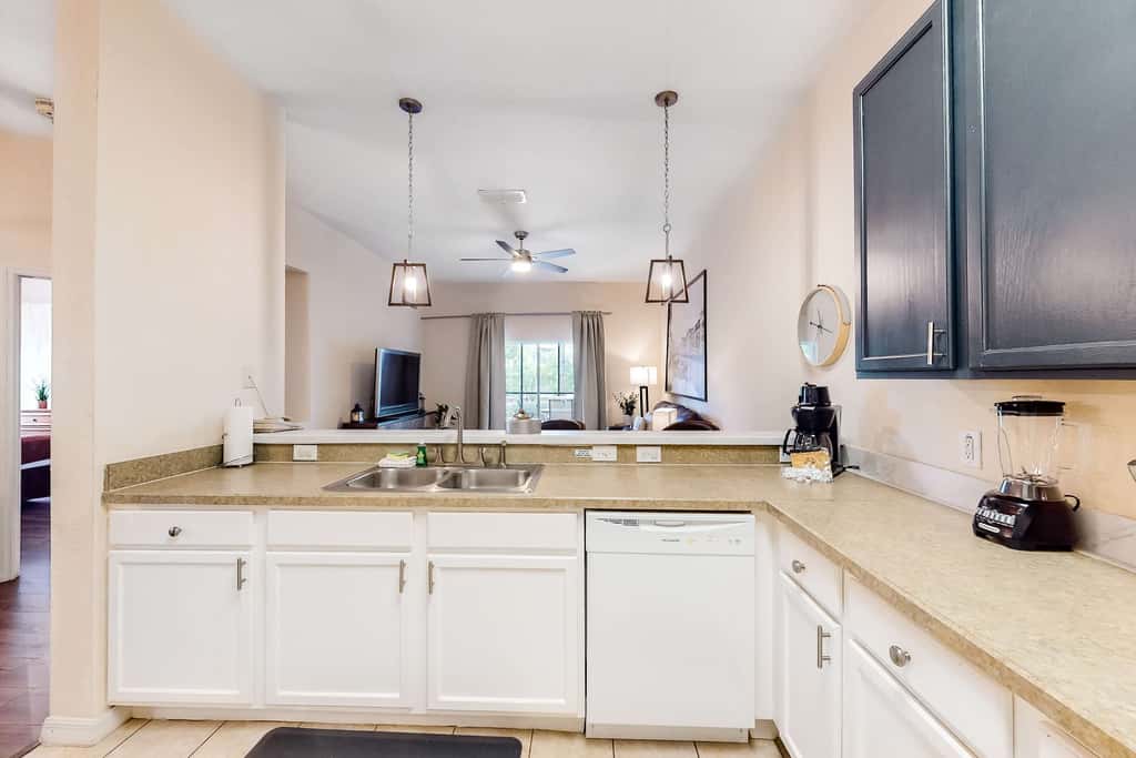 First floor lake view condo w/ pool & hot tub access, private W/D, & central AC