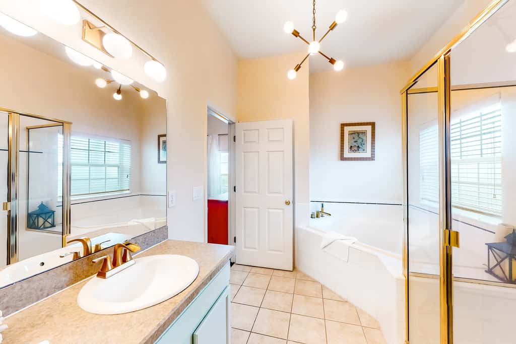 First floor lake view condo w/ pool & hot tub access, private W/D, & central AC