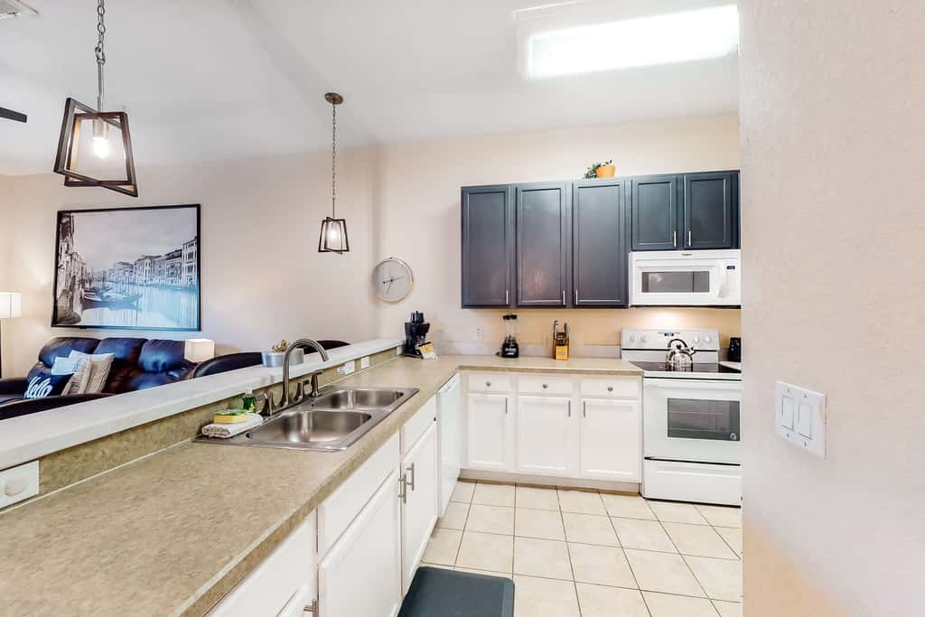First floor lake view condo w/ pool & hot tub access, private W/D, & central AC