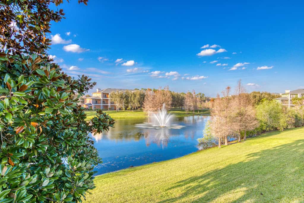 First floor lake view condo w/ pool & hot tub access, private W/D, & central AC