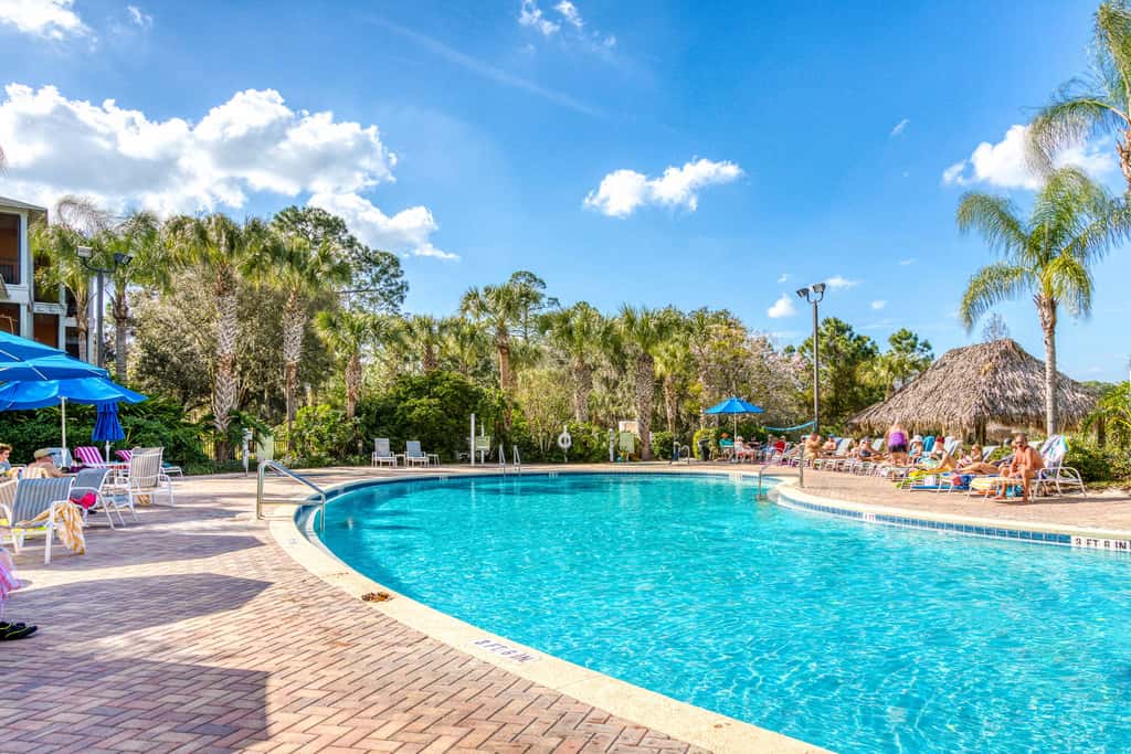 First floor lake view condo w/ pool & hot tub access, private W/D, & central AC