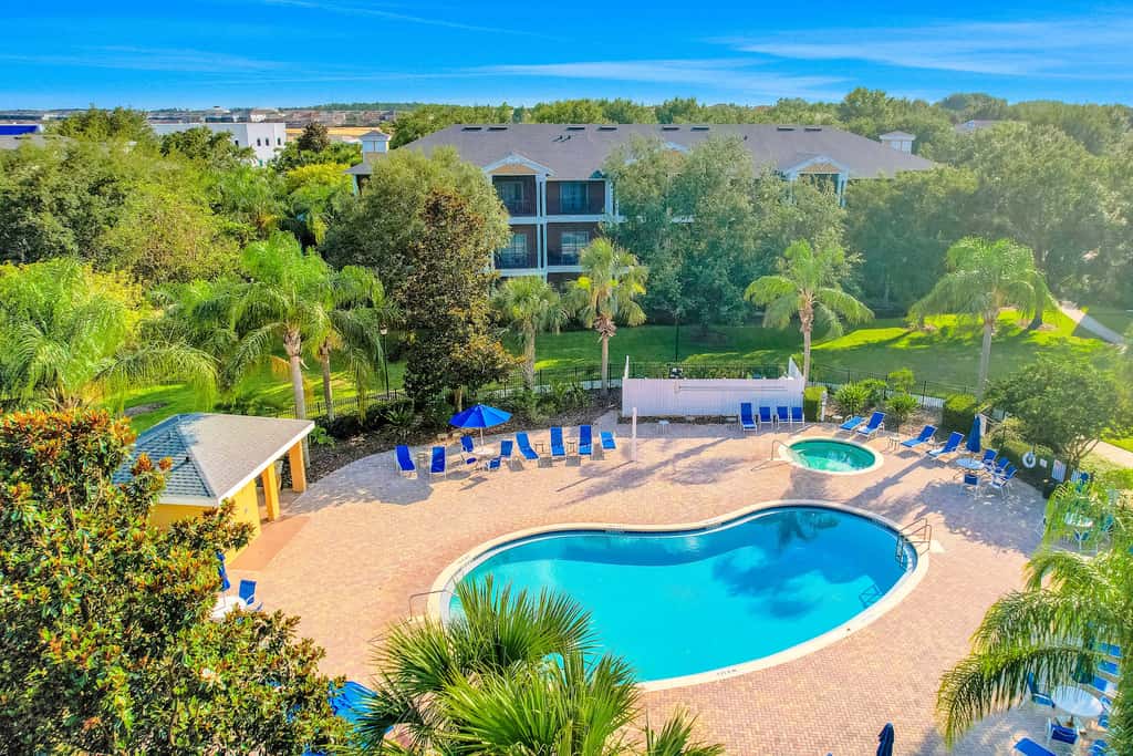 First floor lake view condo w/ pool & hot tub access, private W/D, & central AC