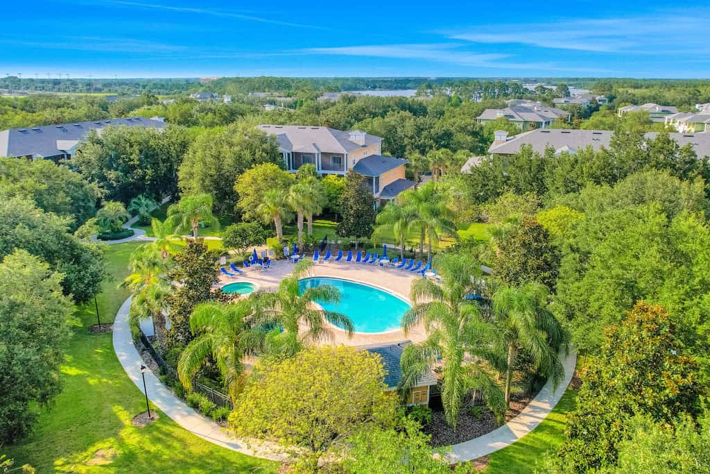 First floor lake view condo w/ pool & hot tub access, private W/D, & central AC