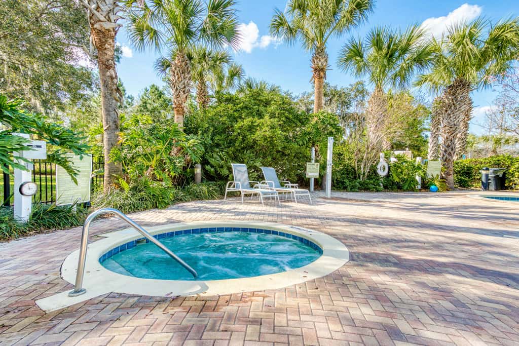 First floor lake view condo w/ pool & hot tub access, private W/D, & central AC