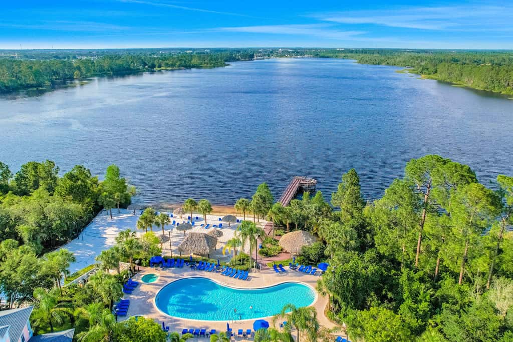First floor lake view condo w/ pool & hot tub access, private W/D, & central AC