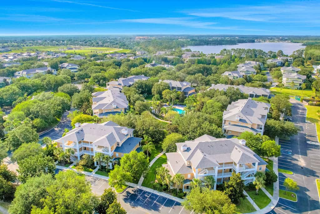 First floor lake view condo w/ pool & hot tub access, private W/D, & central AC