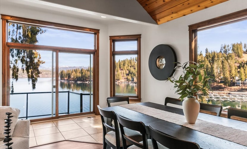 Lake mornings, mountain sunsets, and your private slice of Hayden Lake—bring the whole crew. Welcome to a 4-bedroom, 4-bath home designed for groups and families who want everyone fed, entertained, and happy under one roof. Sleeps 10 across four generously sized bedrooms, each with its own full bathroom. Hot tub with views of the water. Covered dock with 75 feet of deep waterfront access. Game room, movie theater room, sauna, and gym. Kayaks included—launch straight from your private dock. This is the home you book when the whole extended family is coming.