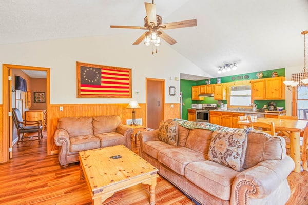Escape to Cozy Vibes, a peaceful 2-bedroom cabin in Wears Valley near Sevierville. Enjoy wooded mountain surroundings, a private hot tub, pool table, fire pit, and spacious gathering areas. Guests also have access to a seasonal community pool and fishing pond at Honeysuckle Meadows. Pigeon Forge, Gatlinburg, and Great Smoky Mountains National Park are all within easy driving distance.
