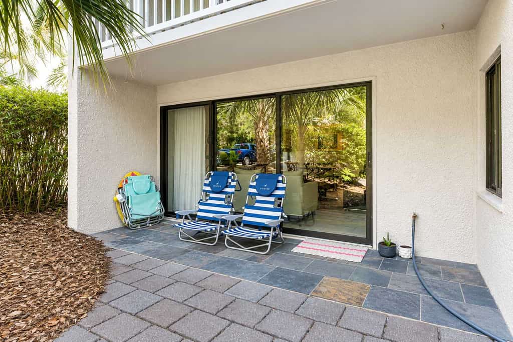 A quiet 2-bedroom villa tucked under tall trees in South Forest Beach. Walk to the beach in under 10 minutes or bike there in 5 minutes along a shaded trail to Alder Lane. Three pools and tennis courts are steps from your door. Sleeps 5 with a king bed, queen bed, and sleeper sofa. Coligny Plaza, with 60-plus shops and restaurants, is a short bike ride away.