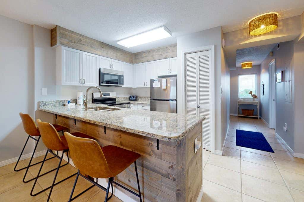 Waterfront condo with shared pool & hot tub - walk to dining & beach