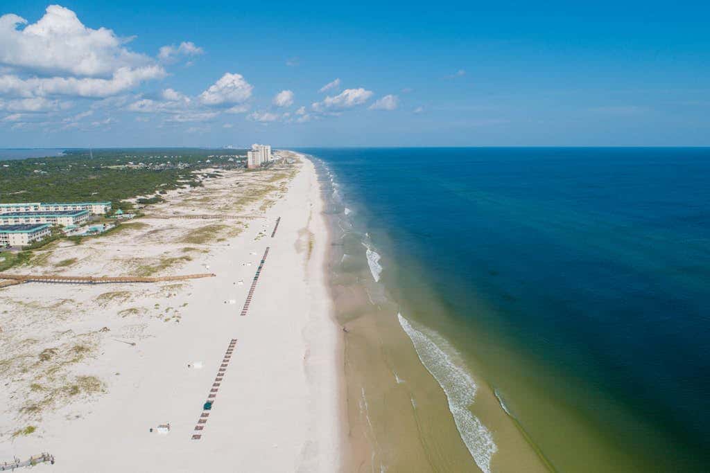 Beachfront condo with balcony, Gulf views, pools, gym, & game room at Plantation Palms