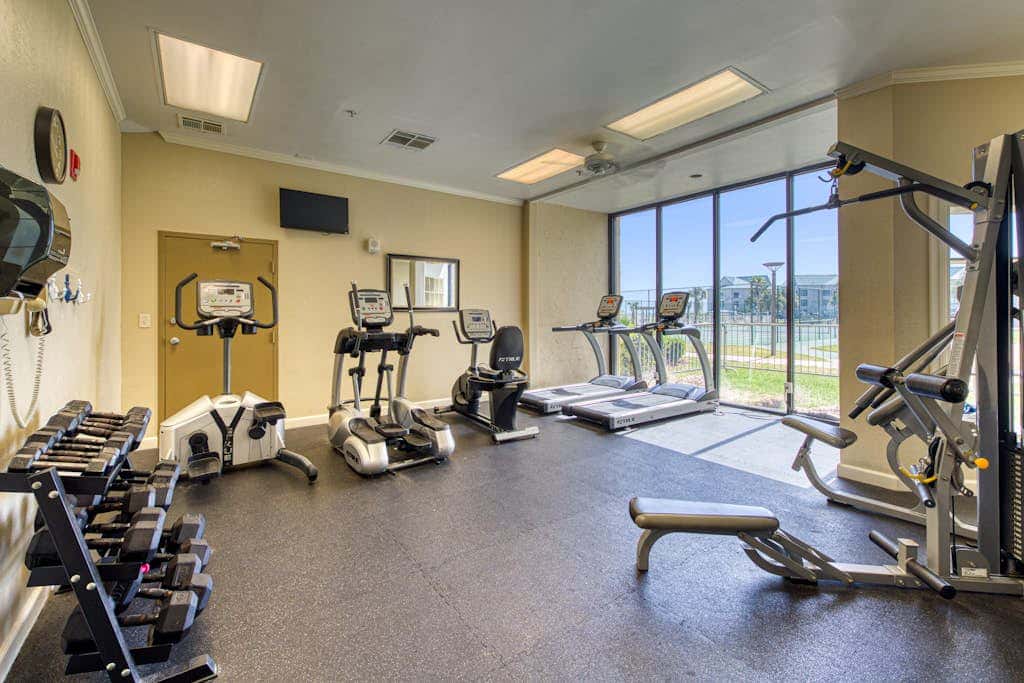 Beachfront condo with balcony, Gulf views, pools, gym, & game room at Plantation Palms
