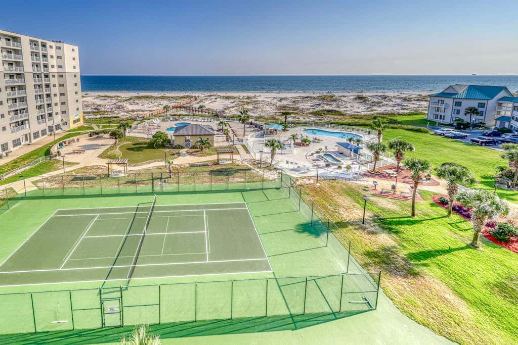 Beachfront condo with balcony, Gulf views, pools, gym, & game room at Plantation Palms