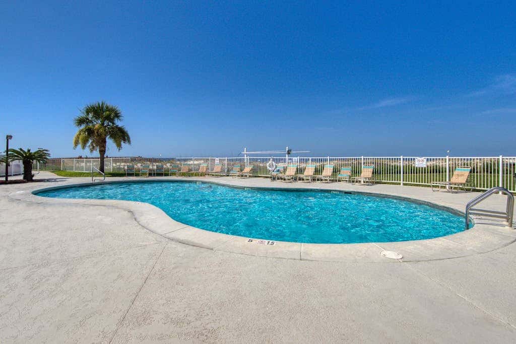 Beachfront condo with balcony, Gulf views, pools, gym, & game room at Plantation Palms
