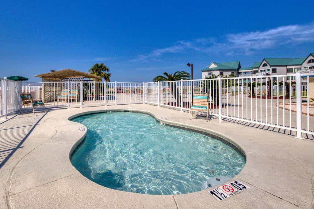 Beachfront condo with balcony, Gulf views, pools, gym, & game room at Plantation Palms