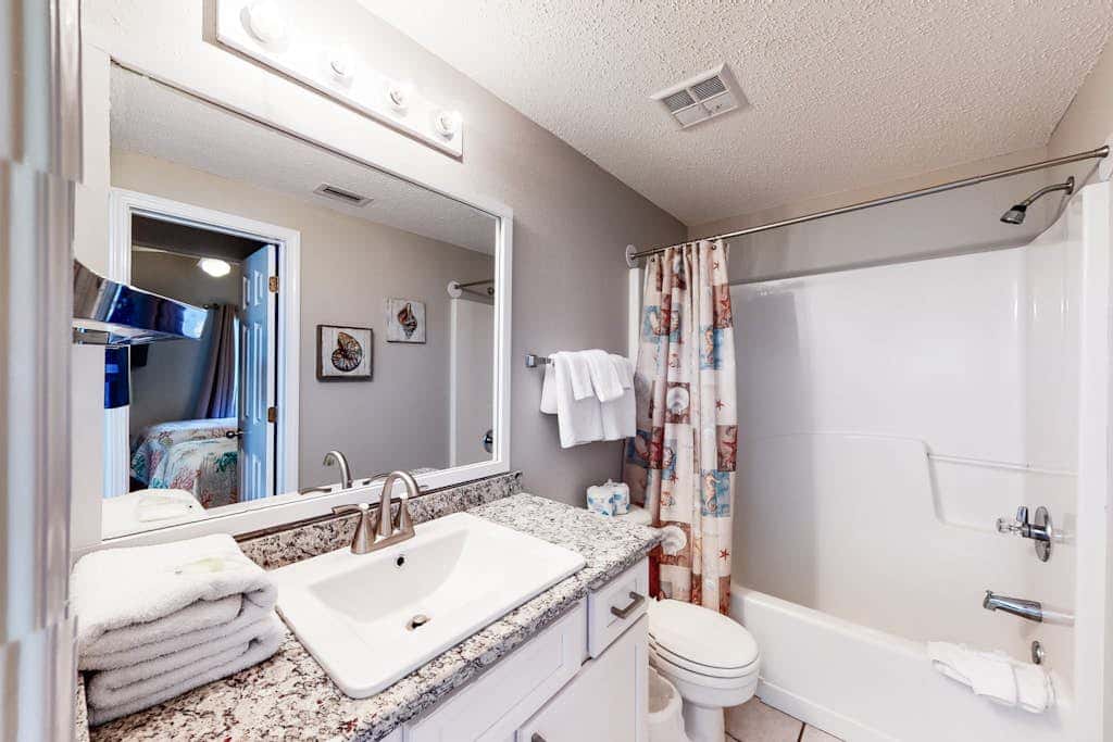 Beachfront vacation home with spacious balconies, beach access, pools & hot tub