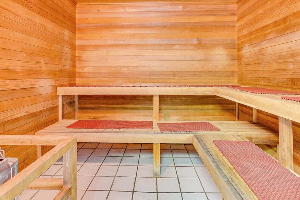 Beach-front condo with pool, hot tub, sauna, washer,dryer & grill