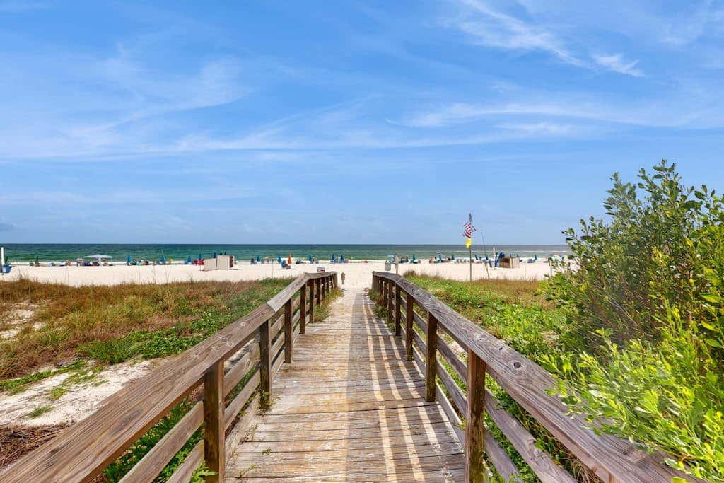Beach-front condo with pool, hot tub, sauna, washer,dryer & grill