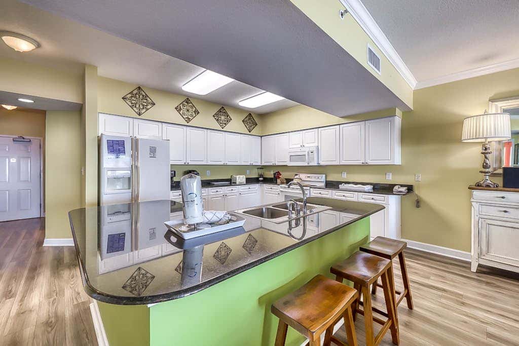 Beachfront condo with private balcony & shared pools, gym & sauna