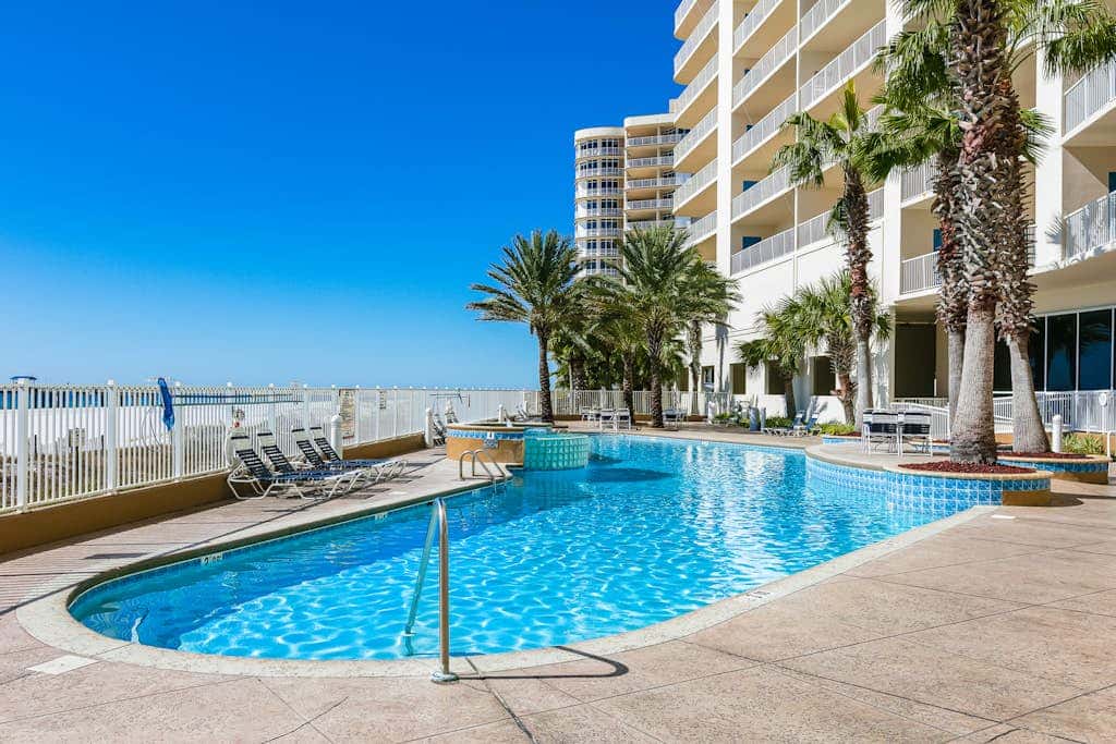 Beachfront condo with private balcony & shared pools, gym & sauna