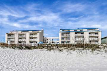 Family-friendly condo with a spacious living area, shared pools, & tennis courts