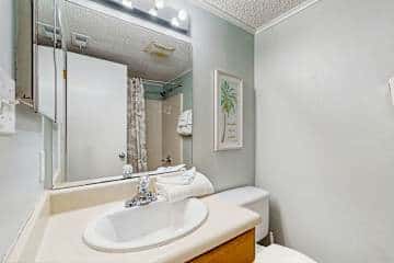 Family-friendly condo with a spacious living area, shared pools, & tennis courts