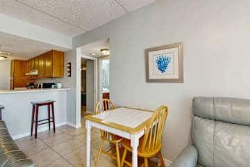 Family-friendly condo with a spacious living area, shared pools, & tennis courts