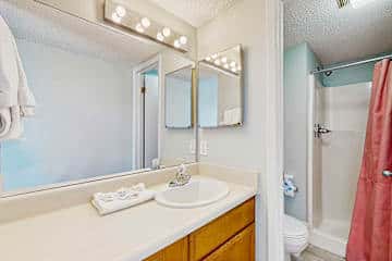 Family-friendly condo with a spacious living area, shared pools, & tennis courts