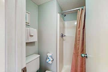 Family-friendly condo with a spacious living area, shared pools, & tennis courts