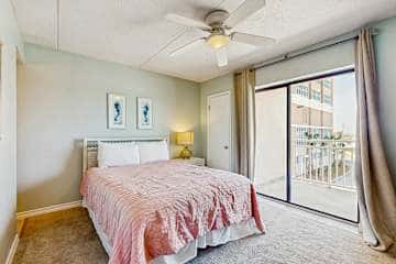 Family-friendly condo with a spacious living area, shared pools, & tennis courts