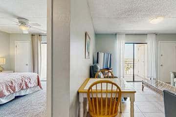 Family-friendly condo with a spacious living area, shared pools, & tennis courts