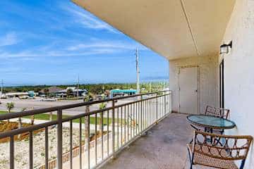 Family-friendly condo with a spacious living area, shared pools, & tennis courts