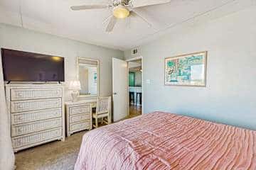 Family-friendly condo with a spacious living area, shared pools, & tennis courts