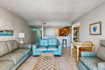 Family-friendly condo with a spacious living area, shared pools, & tennis courts