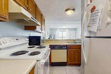Family-friendly condo with a spacious living area, shared pools, & tennis courts