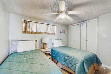 Family-friendly condo with a spacious living area, shared pools, & tennis courts