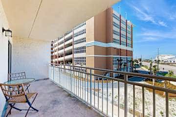 Family-friendly condo with a spacious living area, shared pools, & tennis courts