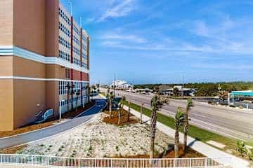 Family-friendly condo with a spacious living area, shared pools, & tennis courts