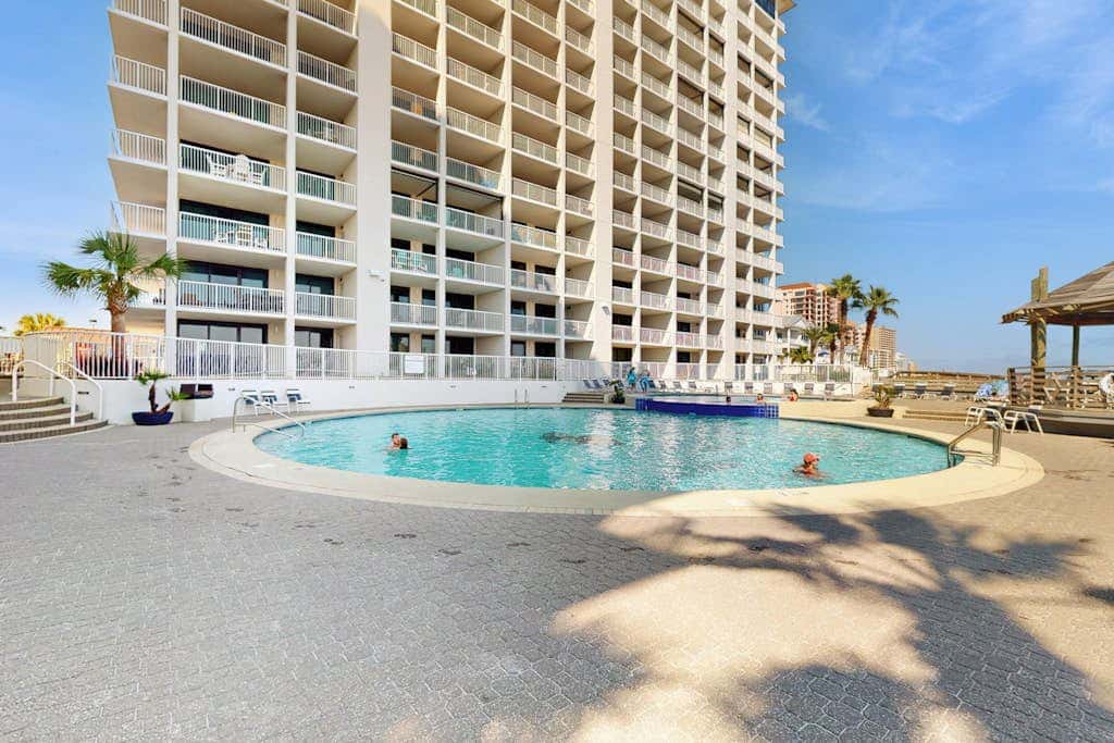 Gulf-front condo with furnished balcony, pools & hot tub