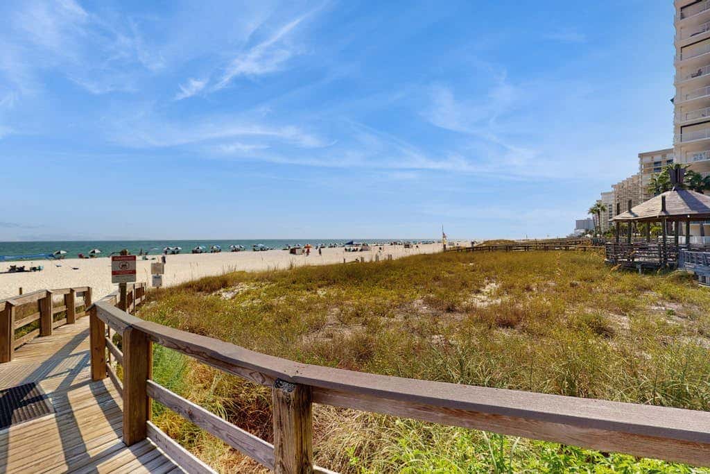 Gulf-front condo with furnished balcony, pools & hot tub