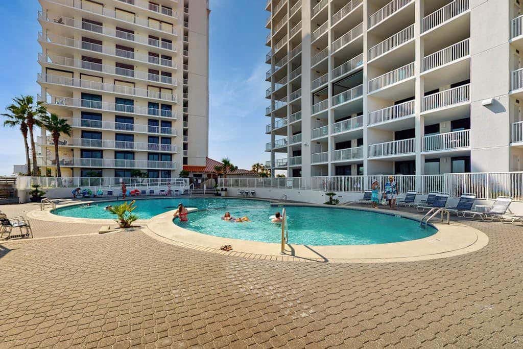 Gulf-front condo with furnished balcony, pools & hot tub
