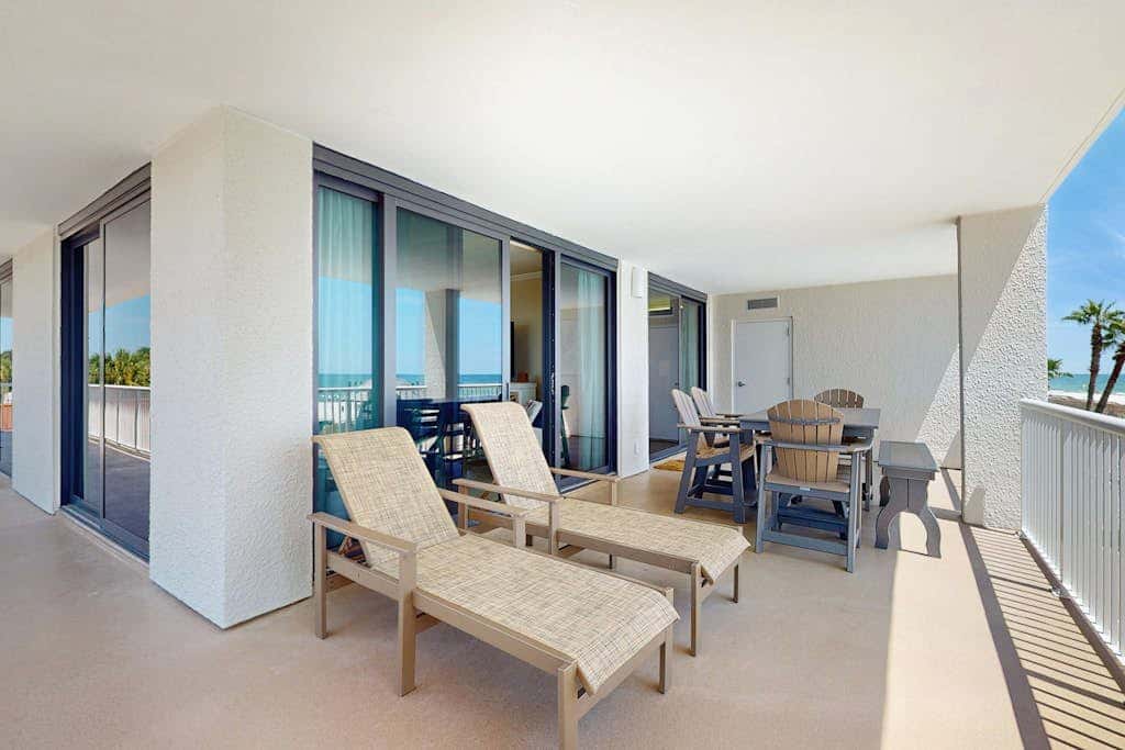 Gulf-front condo with furnished balcony, pools & hot tub