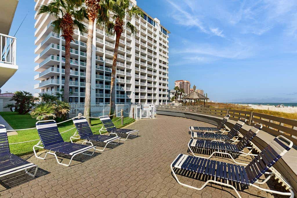 Contemporary Gulf front condo with shared pools, hot tub, fitness center, beach